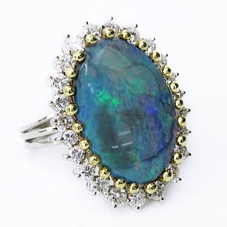 Approx. 9.0 Carat Oval Opal, 2.0 Carat Round Brilliant Cut Diamond and 18 Karat White and Yellow Gold Ring.