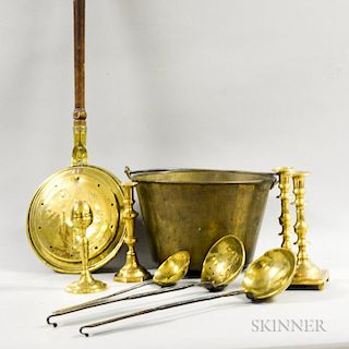 Nine Brass Items, four candlesticks, a bedwarmer, a bucket, and three skimmers.