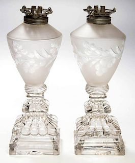 FREE-BLOWN, ENGRAVED, AND PRESSED PAIR OF WHALE OIL STAND LAMPS