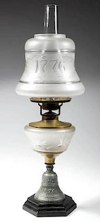 CENTENNIAL BELL FIGURAL STEM KEROSENE STAND LAMP