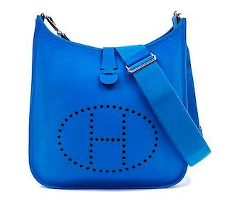 An Hermes Blue Clemence Evelyne III GM Handbag, 13" x 12" x 4"; Strap drop: 19"- 27".