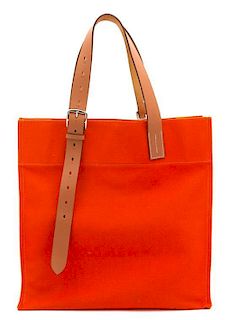 An Hermes Orange Canvas Etiviere Shopping Tote, 16" x 17" x 6"; Strap adjustable to 17".