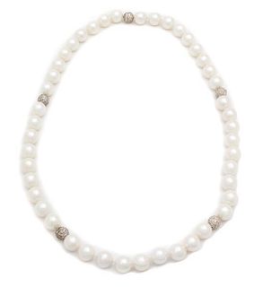 A Pair of Faux South Sea Pearl Necklaces, 18".