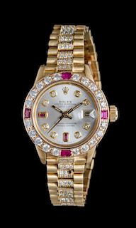 * An 18 Karat Yellow Gold, Diamond and Ruby Ref. 6927 Oyster Perpetual Datejust Wristwatch, Rolex,