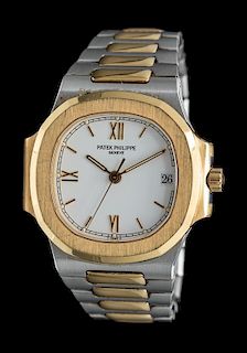 An 18 Karat Yellow Gold and Stainless Steel 'Nautilus' Wristwatch, Patek Philippe,
