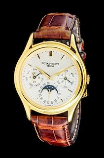 * An 18 Karat Yellow Gold Ref. 3940 Perpetual Calendar Moonphase Wristwatch, Patek Philippe,