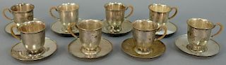 Set of eight sterling silver demitasse cups and saucers, hand hammered with reed wrapped handles. 22.4 t oz.