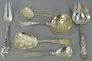 Six piece lot of serving pieces including zacho spoon, frigurt fork, strainer spoon, two berry spoons, and large fork. 12.8 t