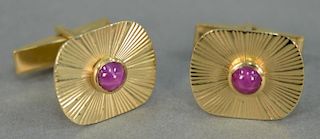 Pair of 14K gold cuff links mounted with star sapphires. 9.7 grams