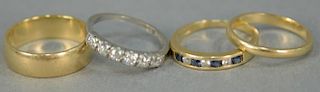 Four piece lot to include platinum diamond band set with six diamonds, 14K band set with alternating diamonds and sapphires,
