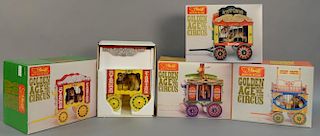 Group of four Golden Age of the Circus pieces in original boxes including carts with stuffed animals.