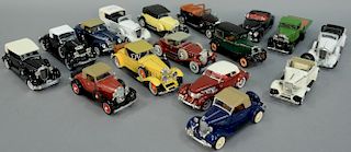 Group of sixteen 1930's model cars including white 1933 Cadillac Town Car, yellow 1933 Cadillac Fleetwood series, black 1933