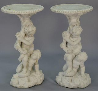 Pair of cement pedestals with figural bases. ht.34 1/2in. dia.18in.