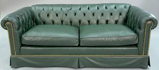 Green leather Chesterfield sofa with two cushions