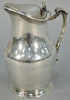 Continental silver hot water pot with copper base.