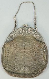 Purse having embossed Continental silver top with lizard skin marked N