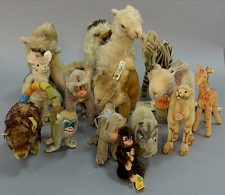 Group of fourteen stuffed mohair animals (mostly Steiff) to include bison, three camels, zebra, two llamas, rhinoceros, Jocko
