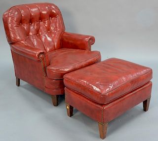 Two piece lot to include red leather chair and ottoman.