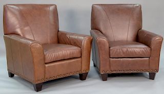Pair of brown leather upholstered easy chairs. ht. 42in., wd. 35in.