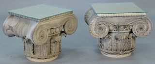 Pair of wood Corinthian capitals set as end tables with glass tops, probably 19th century