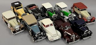 Group of ten 1930's model cars including 1930 red and cream Packard 1:18 scale, Duesenberg black and green 1:18 scale, 1934 D