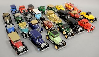 Group of twenty-five 1930's model cars including 1932 Chevrolet Roadster pickup, 1933 gold Cadillac towncar, 1931 Ford Model