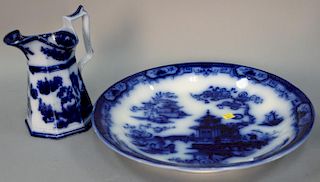 Flow blue and white charger and pitcher, charger marked Hindostan Petrus Regout and pitcher marked Ironstone Chapoo.