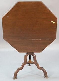 English carved mahogany tilt top tea table, 19th century, the octagonal shaped tip top on standard with tripod base. 
ht. 26i