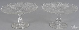 Pair of Tuthill brilliant cut glass tazza with vine and berry motif, unsigned, 4 1/2'' x 8''.