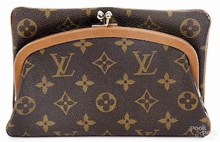 Louis Vuitton monogrammed clutch, 10 1/4'' h., 7 1/2'' w.