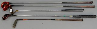 Group of five golf clubs including two MacGregor Fancy face drivers and a Ginty Stand Thompson, Beckley Ralston Iron Shaft Pu