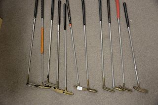 Group of eleven golf club putters with brass ends to include Armadillo greenfee putter, Bob Toski Mighty Mitess putter, six A