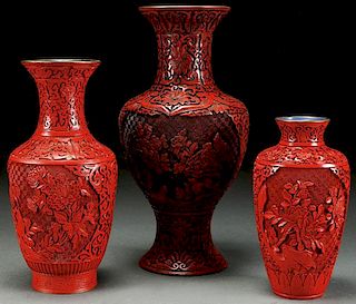 A GROUP OF THREE CHINESE CARVED CINNABAR RED