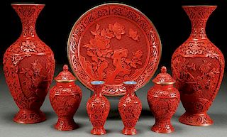 A SEVEN PIECE GROUP OF CHINESE CARVED CINNABAR