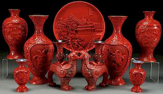 A NINE PIECE GROUP OF CHINESE CARVED CINNABAR RED