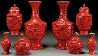 AN EIGHT PIECE GROUP OF CHINESE CARVED CINNABAR