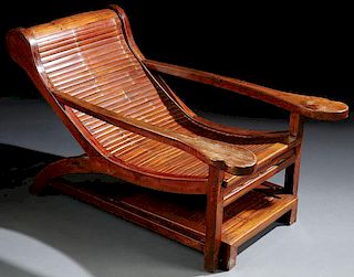 A CHINESE HARDWOOD AND BAMBOO PROMENADE CHAIR