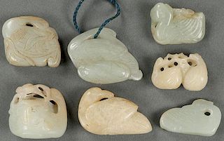 A GROUP OF SEVEN CHINESE CARVED WHITE JADE