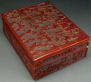 A CHINESE CARVED CINNABAR LACQUER LIDDED BOX