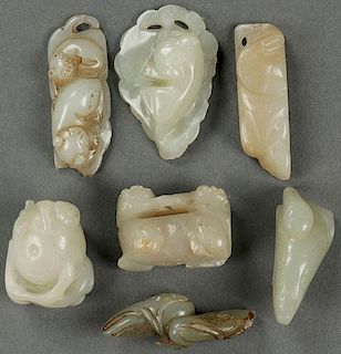 A GROUP OF SEVEN CARVED WHITE JADE ORNAMENTS