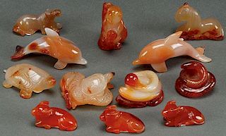 A GROUP OF 12 CHINESE CARVED CARNELIAN AGATE
