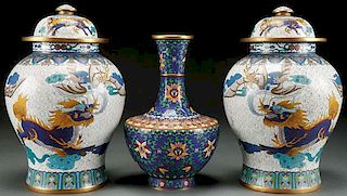 A PAIR OF CHINESE ENAMELED COVERED JARS AND VASE