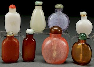 A COLLECTION OF EIGHT CHINESE CARVED GLASS SNUFF