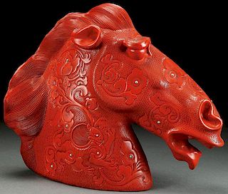 A CHINESE CARVED CINNABAR RED LACQUER HORSEHEAD