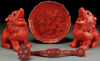 A GROUP OF FOUR CHINESE CARVED CINNABAR RED