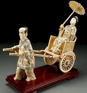 A LARGE CHINESE CARVED BONE FIGURAL GROUP
