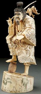 A CHINESE CARVED BONE FIGURE OF A FISHERMAN