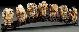 A SET OF SEVEN CHINESE CARVED BONE LUCK GODS