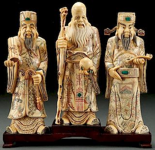A GROUP OF THREE CHINESE CARVED BONE FIGURES