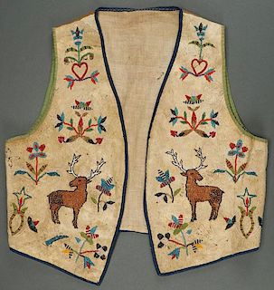A PROBABLY SANTEE SIOUX BEADED HIDE VEST